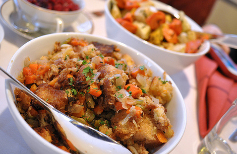 Serving bowls of stuffing and vegetables