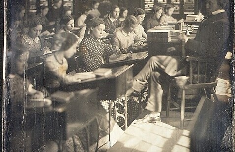 A daguerrotype photo of an old classroom