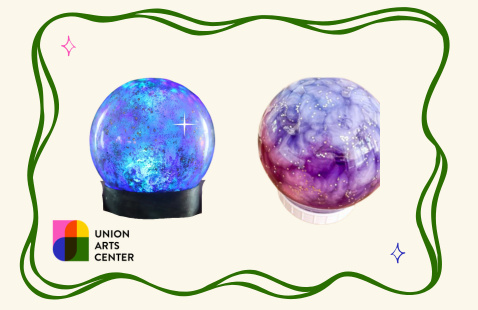 Two crystal balls with the words "Union Arts Center" on the bottom left of the frame.