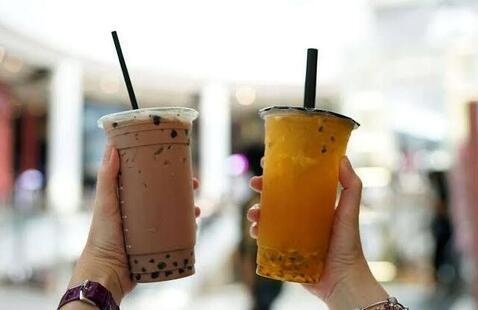 People holding boba