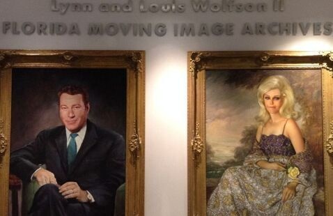 Portraits of Lynn and Louis Wolfson II in the Archives' lobby