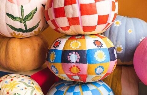 Stacked painted pumpkins