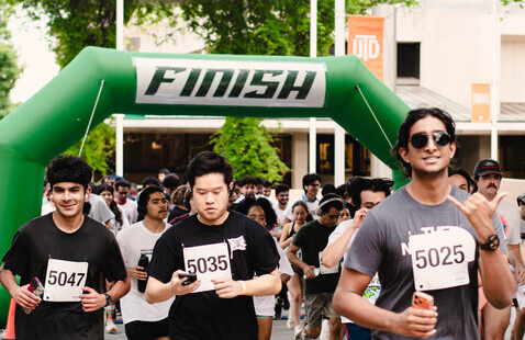 Runners at a 5k starting line