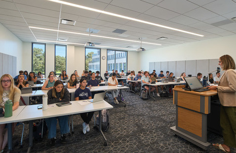 instructor leading a class in a classroom in Tulloch Business Building