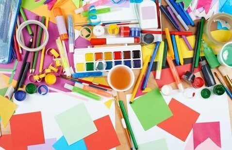a variety of craft supplies splayed out across a table