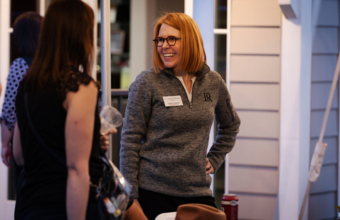 Summer McGee talking with alumni at a reunion gathering