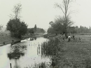 People on bikes next to the Chenango Canal - Image courtesy of the Colgate Special Collections and University Archives