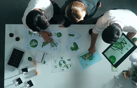  Aerial view of business team working together and planning to use sustainable environmental energy.