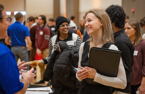 Student interacting with a recruiter.