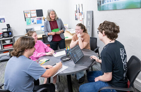 Students talking around table in Clemmer-Long Center for Vocation and Purpose