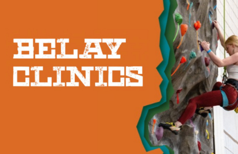 BELAY CLINICS - woman in harness ascending indoor climbing wall, reaching for a hold, colorful handholds visible