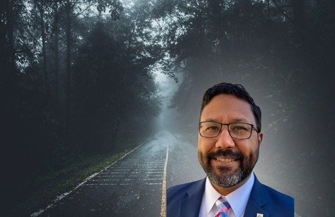 Headshot of Sergio Nanita in front of two-lane highway background scene