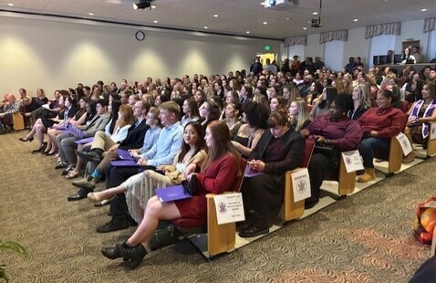 A group of people in an auditorium