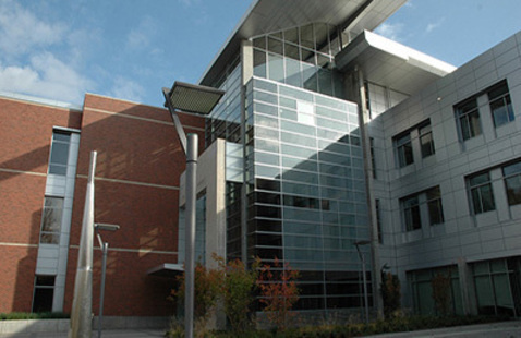 Exterior of a red-brick and glass building on Corvallis campus.