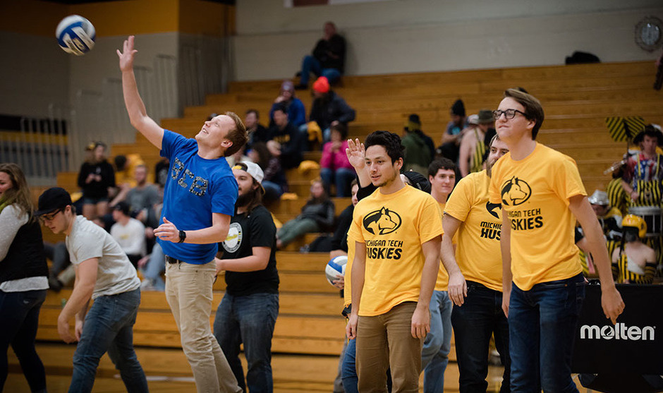 Students playing volleyball.